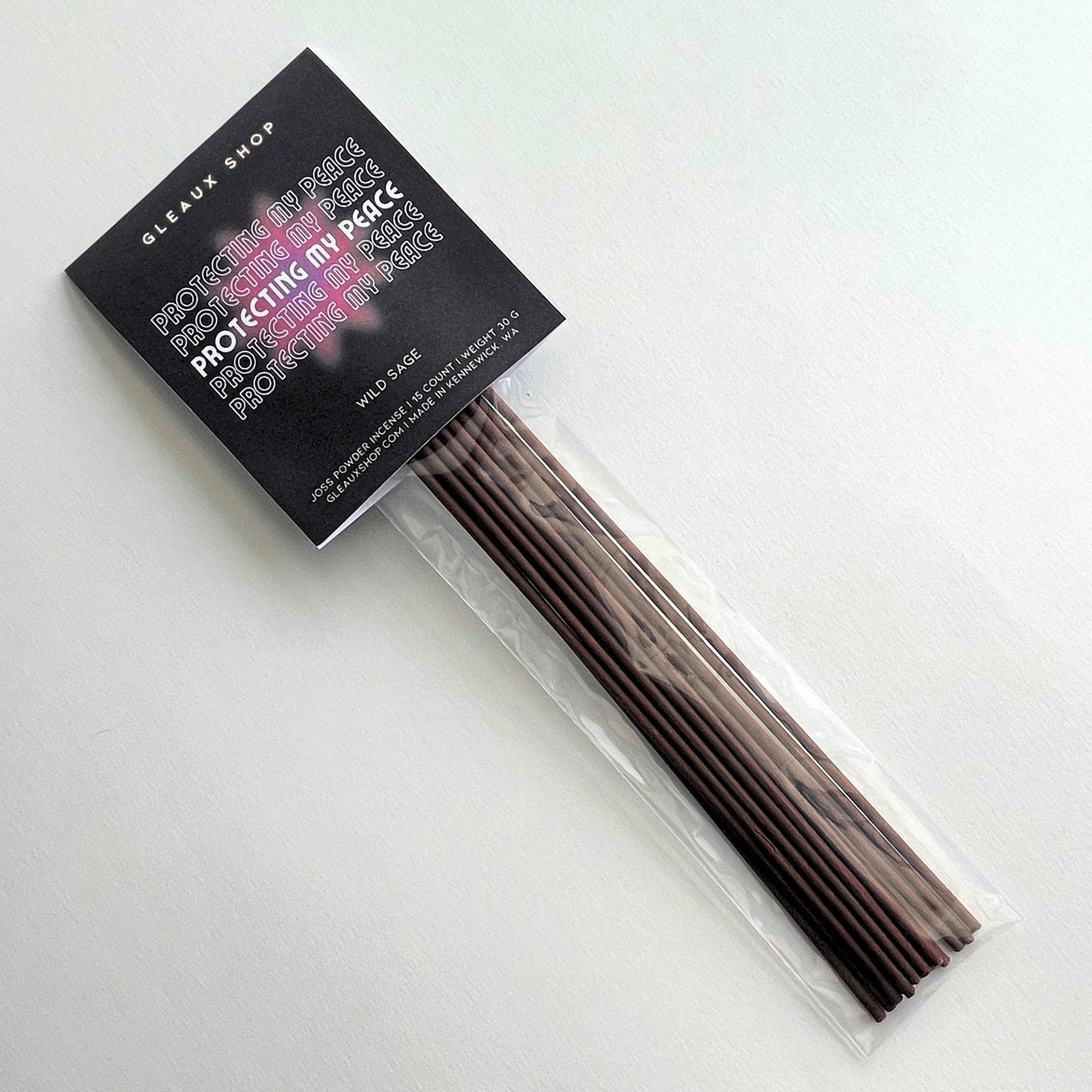 A pack of Protecting My Peace Wild Sage incense sticks by Gleaux Shop, displayed in a clear packaging with a black label.