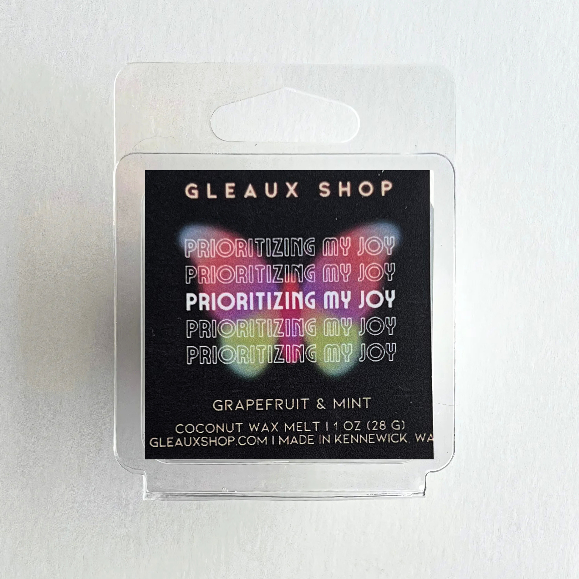 Grapefruit and mint scented wax melts by Gleaux Shop displayed in a minimalist setting