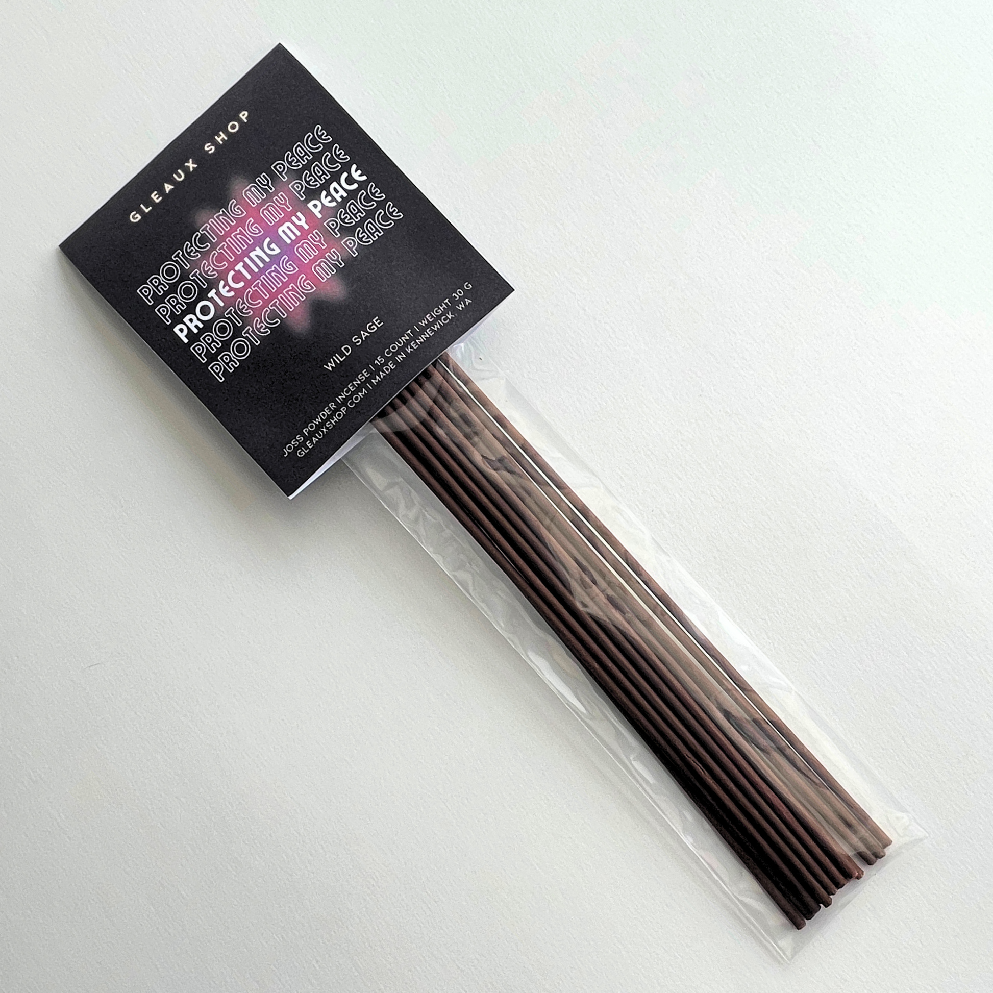 A pack of Protecting My Peace Wild Sage incense sticks by Gleaux Shop, displayed in a clear packaging with a black label.
