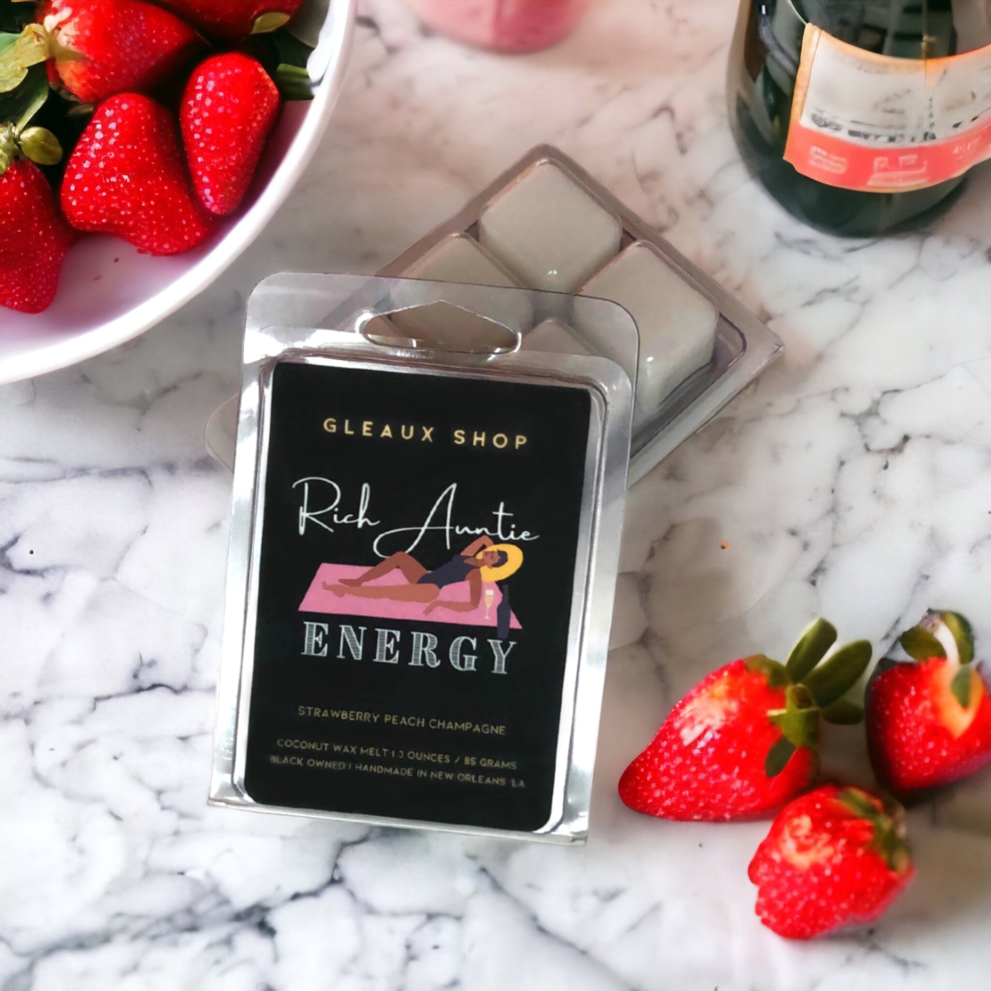 Strawberry Peach Champagne wax melts by Gleaux Shop arranged on a neutral surface